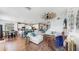Open concept living area with hardwood floors, brick fireplace, dining area and kitchen at 5040 Inshore Landing Dr, Apollo Beach, FL 33572