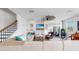 Comfortable living room with a fireplace, shiplap walls, and a staircase at 5040 Inshore Landing Dr, Apollo Beach, FL 33572