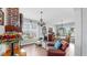 Comfortable Living Room with hardwood floors, Tiffany lamp, dining area, and neutral paint at 5040 Inshore Landing Dr, Apollo Beach, FL 33572