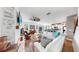 Open concept living room and kitchen area featuring ample seating and natural light at 5040 Inshore Landing Dr, Apollo Beach, FL 33572
