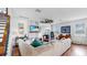 Inviting living room featuring a fireplace, shiplap walls, and cozy furnishings at 5040 Inshore Landing Dr, Apollo Beach, FL 33572