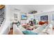 Bright living room featuring a fireplace, shiplap walls, and cozy furnishings at 5040 Inshore Landing Dr, Apollo Beach, FL 33572