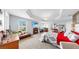 Expansive main bedroom with a cozy fireplace, a seating area, and elegant decor creating a peaceful retreat at 5040 Inshore Landing Dr, Apollo Beach, FL 33572