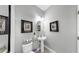 Chic powder room with a pedestal sink, framed artwork, and stylish decor for a refined touch at 5040 Inshore Landing Dr, Apollo Beach, FL 33572