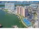 Expansive aerial view of waterfront condos, marina, tennis courts, and swimming pool at 51 Island Way # 503, Clearwater Beach, FL 33767