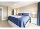 Well-lit bedroom with a large bed, sliding closet door, and ample natural light at 51 Island Way # 503, Clearwater Beach, FL 33767