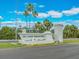 Elegant community entrance sign amidst lush palm trees, creating a welcoming and prestigious atmosphere at 51 Island Way # 503, Clearwater Beach, FL 33767