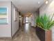 Well lit hallway and elevator access with neutral paint and stylish flooring at 51 Island Way # 503, Clearwater Beach, FL 33767