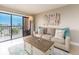 Comfortable living room with a view from a large sliding glass door and modern furnishings at 51 Island Way # 503, Clearwater Beach, FL 33767