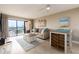 Cozy living room with sliding glass door access to balcony and modern furnishings at 51 Island Way # 503, Clearwater Beach, FL 33767