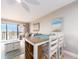 Comfortable living room with a view from a large sliding glass door and modern furnishings at 51 Island Way # 503, Clearwater Beach, FL 33767