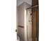 Updated shower with hand-held showerhead and sliding glass door enclosure at 5714 Cheyenne St, Zephyrhills, FL 33542