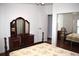 Bedroom featuring a mirrored closet, hardwood floors, and natural light at 5714 Cheyenne St, Zephyrhills, FL 33542