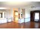 Bright, open concept living room and dining area with hardwood floors and lots of natural light at 5714 Cheyenne St, Zephyrhills, FL 33542