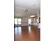Open living room with hardwood floors, neutral paint and a ceiling fan at 5714 Cheyenne St, Zephyrhills, FL 33542