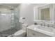 Modern bathroom featuring marble accents, sleek glass shower, and contemporary fixtures at 5744 150Th N Ave, Clearwater, FL 33760
