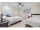 Bright bedroom with two twin beds, a desk, and closet space at 5744 150Th N Ave, Clearwater, FL 33760