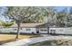 Charming white brick home with a well-manicured lawn and inviting curb appeal at 5744 150Th N Ave, Clearwater, FL 33760