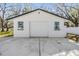 Detached garage with two windows and concrete driveway at 5744 150Th N Ave, Clearwater, FL 33760