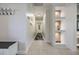 Hallway with decorative niches, neutral paint, and tile flooring at 5744 150Th N Ave, Clearwater, FL 33760