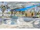 Backyard pool area with lounging chairs, custom shade coverings and a private outdoor feel at 5744 150Th N Ave, Clearwater, FL 33760