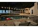 Backyard pool area with string lights, comfortable seating, and floats at 5744 150Th N Ave, Clearwater, FL 33760