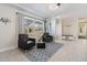 Bright sitting room featuring large windows and comfortable seating at 5744 150Th N Ave, Clearwater, FL 33760