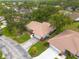 Desirable home with tile roof nestled amongst mature trees and lush landscaping offering privacy and shade at 5812 Garden Lakes Majestic, Bradenton, FL 34203