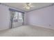 Bedroom with natural light, neutral carpet, and a window overlooking the yard at 5812 Garden Lakes Majestic, Bradenton, FL 34203