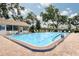 The community pool features clean blue water, lounge chairs, and a pool house under sunny skies at 5812 Garden Lakes Majestic, Bradenton, FL 34203