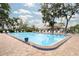 Community pool with a brick deck, clear water, and lounge chairs for residents to enjoy at 5812 Garden Lakes Majestic, Bradenton, FL 34203