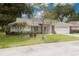 Charming single-story home featuring a tile roof, well-maintained lawn, and an attached two-car garage at 5812 Garden Lakes Majestic, Bradenton, FL 34203