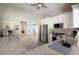 Kitchen showcasing stainless steel appliances, granite countertops, and open view to gathering area at 5812 Garden Lakes Majestic, Bradenton, FL 34203