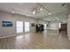 Large recreation room with mirrors and ping pong table, providing an area for fitness and activities at 5812 Garden Lakes Majestic, Bradenton, FL 34203