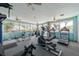 Fully equipped community gym with treadmills, elliptical machines, and large windows for natural light at 5812 Garden Lakes Majestic, Bradenton, FL 34203