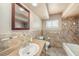 Bathroom with neutral decor, updated vanity, and tiled shower and bath at 5905 Berkford Dr, Holiday, FL 34690