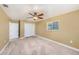 Bedroom featuring carpet, natural lighting and closet space at 5905 Berkford Dr, Holiday, FL 34690