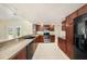 Modern kitchen features stainless steel appliances, ample counter space, and well-lit workspace at 5905 Berkford Dr, Holiday, FL 34690
