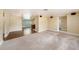 Open-concept living area with carpet, wood flooring, and speakers at 5905 Berkford Dr, Holiday, FL 34690