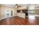 Inviting living area with wood floors, French doors, and modern kitchen at 5905 Berkford Dr, Holiday, FL 34690