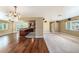 The living space seamlessly connects carpeted living room to updated kitchen at 5905 Berkford Dr, Holiday, FL 34690