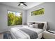 Bright bedroom features ample natural light from two windows and neutral decor at 607 W Euclid Ave # 3, Tampa, FL 33602