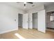 Spacious bedroom with hardwood floors, ceiling fan, closet, and bathroom at 607 W Euclid Ave # 3, Tampa, FL 33602