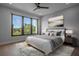 Bright bedroom features a ceiling fan, large windows, and soft layered textures at 607 W Euclid Ave # 3, Tampa, FL 33602