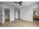 Spacious bedroom with hardwood floors, ceiling fan, closet, and bathroom at 607 W Euclid Ave # 3, Tampa, FL 33602