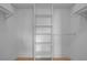 Walk-in closet with custom shelving for optimal storage and organization at 607 W Euclid Ave # 3, Tampa, FL 33602