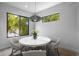 Bright dining area features modern lighting, a marble table and ample natural light at 607 W Euclid Ave # 3, Tampa, FL 33602