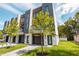Contemporary townhomes with modern design, landscaped yards, and private garage entrances at 607 W Euclid Ave # 3, Tampa, FL 33602
