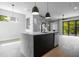 Open concept kitchen with marble countertops, stainless steel appliances, and modern pendant lighting at 607 W Euclid Ave # 3, Tampa, FL 33602