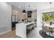 This modern kitchen features marble counters and backsplash with stainless steel appliances at 607 W Euclid Ave # 3, Tampa, FL 33602